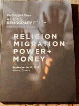 Athens democracy forum. Religion migration power + money.